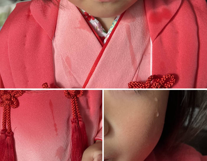 涙を流す幼児と着物